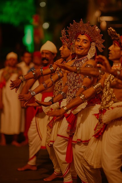 Kandyan dancers performing in a festive celebration.